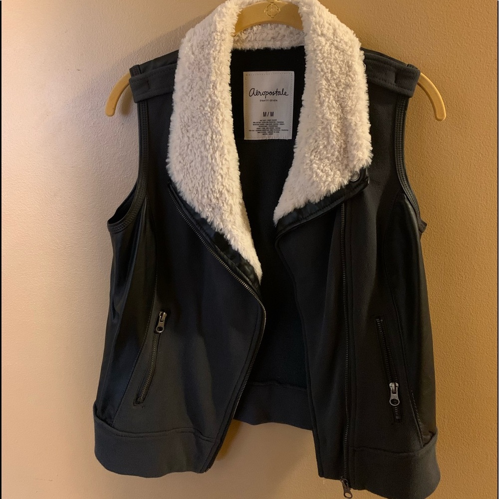 faux leather black vest with a fur collar.